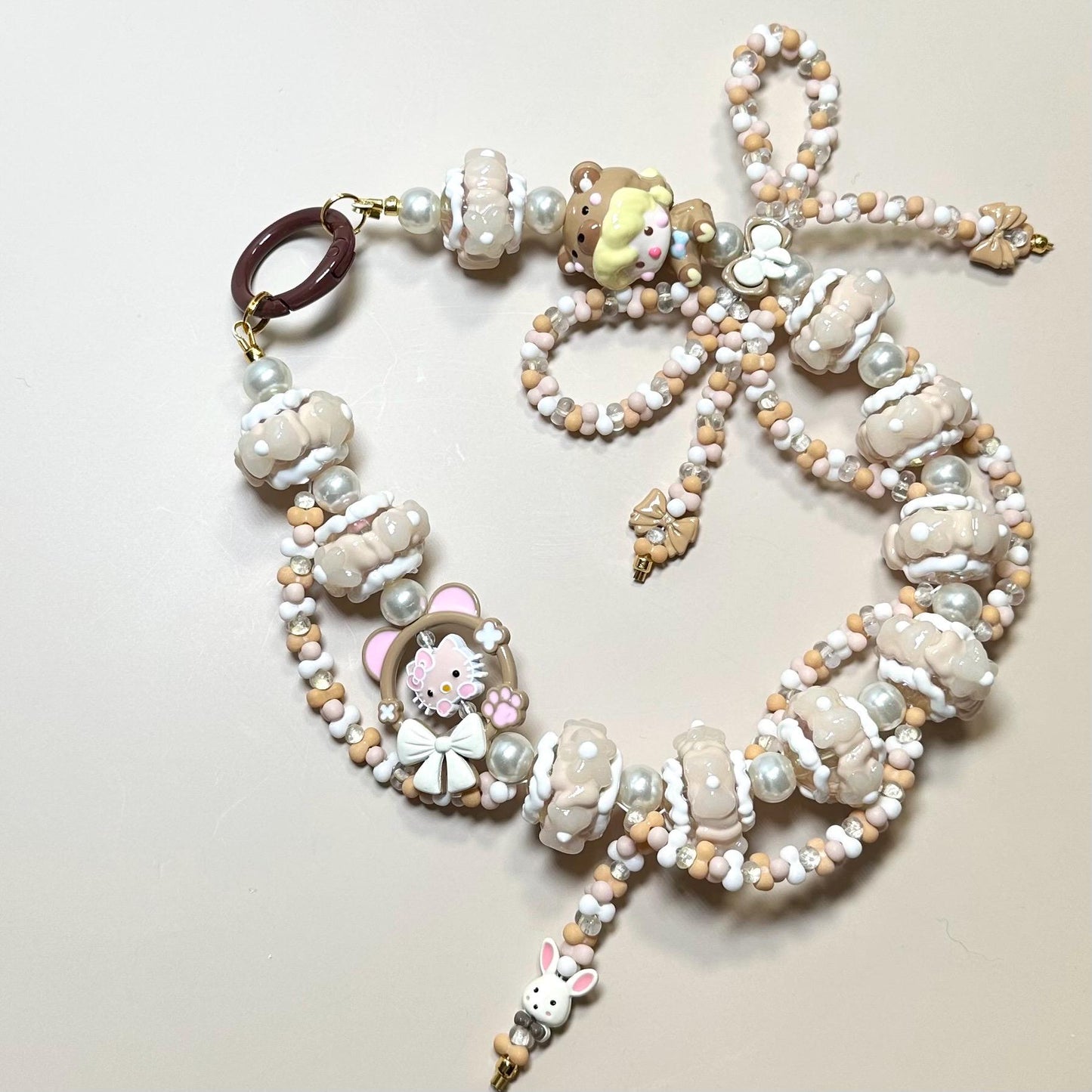 Cream and White Dimoo Hand Painted Phone Strap