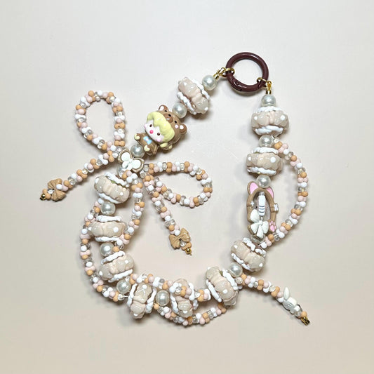Cream and White Dimoo Hand Painted Phone Strap