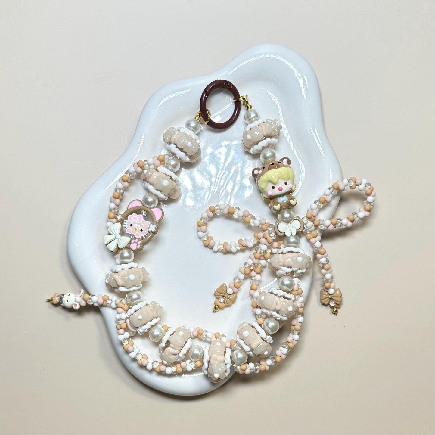 Cream and White Dimoo Hand Painted Phone Strap