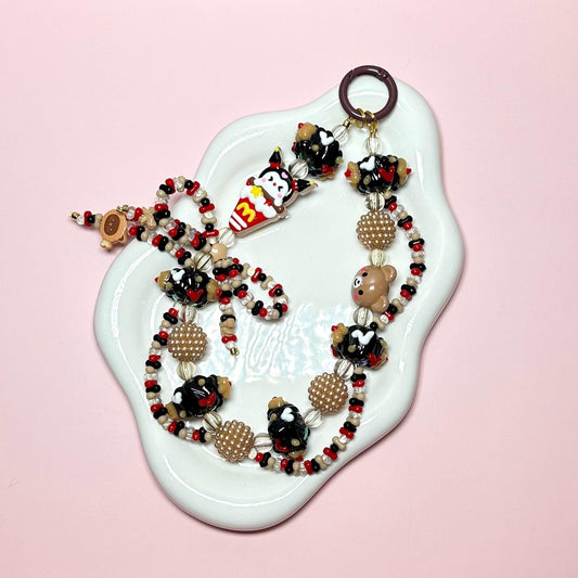 Red and Brown Kuku inspired Hand Painted Car Hanger