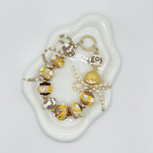 Cream and Brown Dimoo Hand Painted Phone Strap | Bag Charm