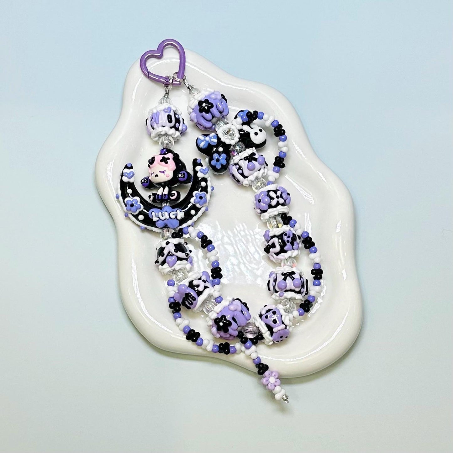 Purple and black SkullPanda inspired Hand Painted Phone Strap | Bag Charm